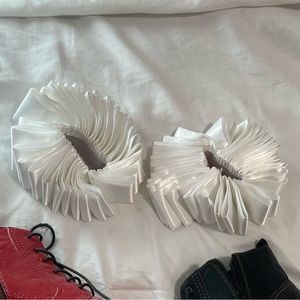 Cuffs correlating with the Harley Quinn costume